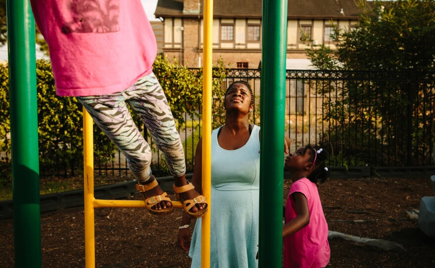 Briceshanay Gresham (center) takes her daughter Uri (right) and sister Dyha to their neighborhood playground in New Orleans. Briceshanay was in college during Katrina and escaped swirling, waist-high water with only the clothes she was wearing that day.
