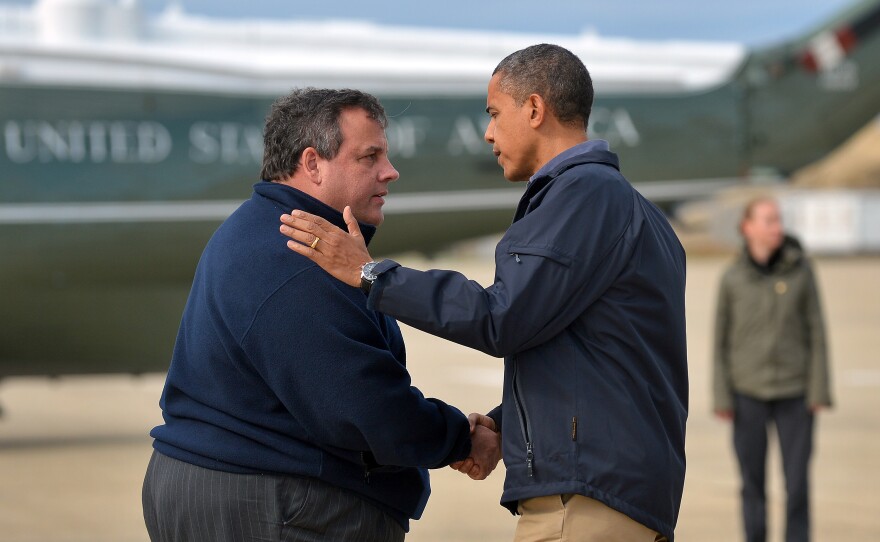 President Barack Obama (at right) is greeted by New Jersey Gov. Chris Christie upon arriving in Atlantic City, N.J., on October 31, 2012 to visit areas hardest hit by Superstorm Sandy.