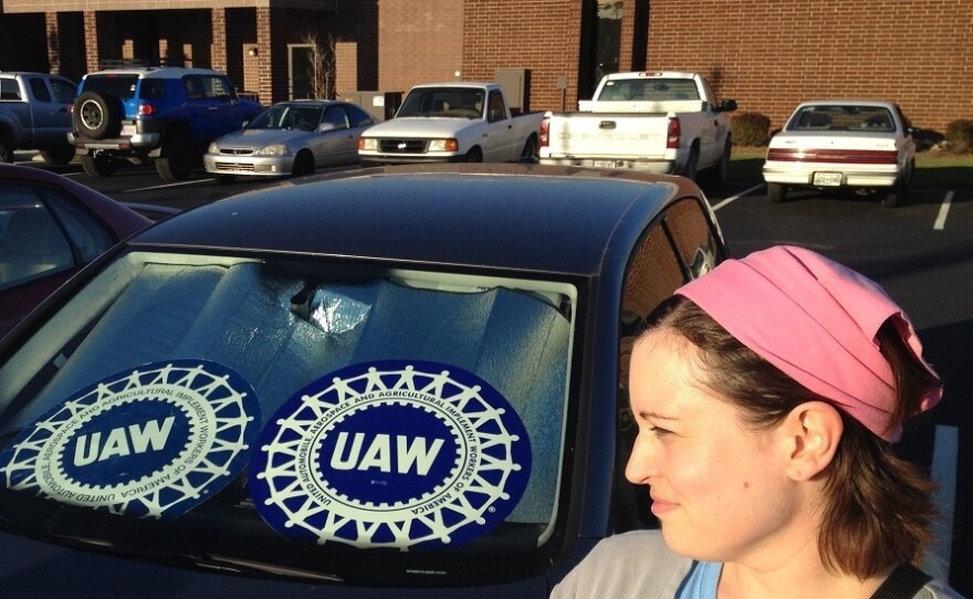 Lauren Feinauer works at the Chattanooga plant. She props UAW signs in the windshield and rear window while she's parked at work.