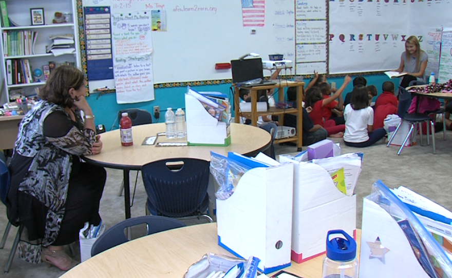 America's Finest Charter School Director Jan Perry observes Cassandra Tinyo's class, Nov. 2, 2015.