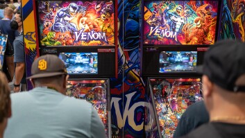 Comic-Con attendees play a Venom-themed pinball game at the Stern Pinball both inside the main exhibit hall, Friday, July 21, 2023. 