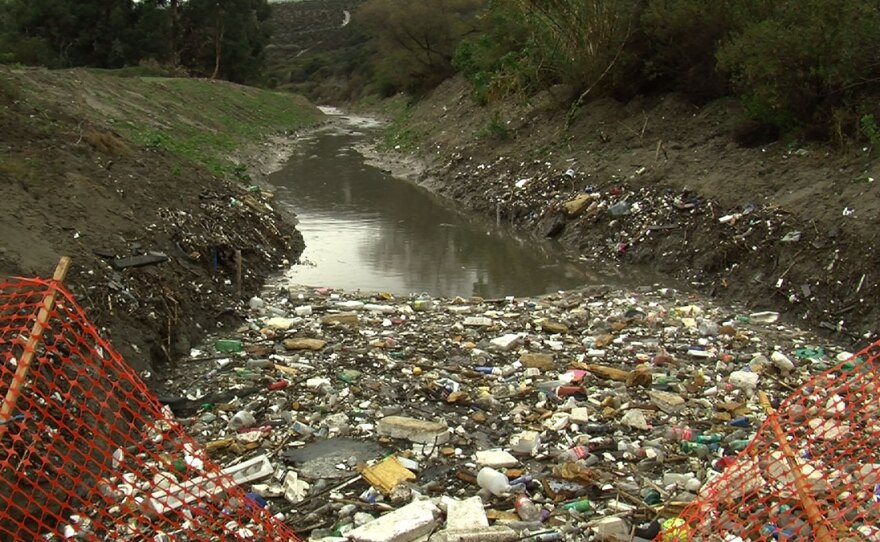 Trash fills a binational waterway in the Tijuana River Valley near the San Diego-Mexico border, Jan. 5, 2016.