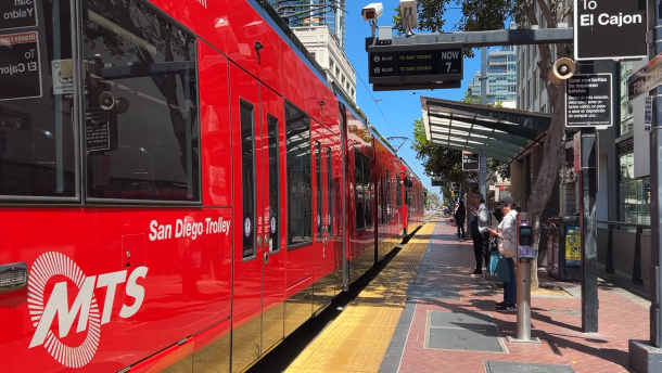 Riders wait to board the Blue Line trolley at the Fifth Avenue station in downtown San Diego on Wednesday, May 6, 2026.
