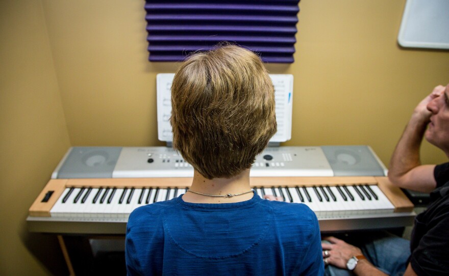 Reed takes a piano class with Christopher Maloney at Absolute Music Studios in Jupiter, Fla.