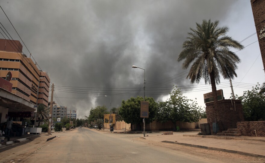 Smoke is seen rising from a neighborhood in Khartoum, Sudan, Saturday, April 15, 2023.