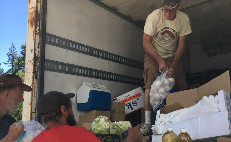 Jeff England, director of the Trinity County Food Bank, delivers items in remote Zenia, Calif. The closest large grocery store is 100 miles away.