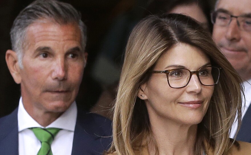Actress Lori Loughlin and her husband, clothing designer Mossimo Giannulli (left), announced on Monday that they would plead not guilty to charges in the Justice Department's college admissions case. Here, they leave federal court in Boston earlier this month.