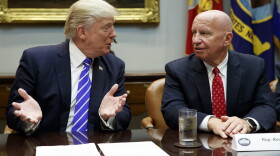 Rep. Kevin Brady, R-Texas, right, listens as President Donald Trump speaks during a meeting with members of the House Ways and Means committee in the Roosevelt Room of the White House in Washington, Sept. 26, 2017. 