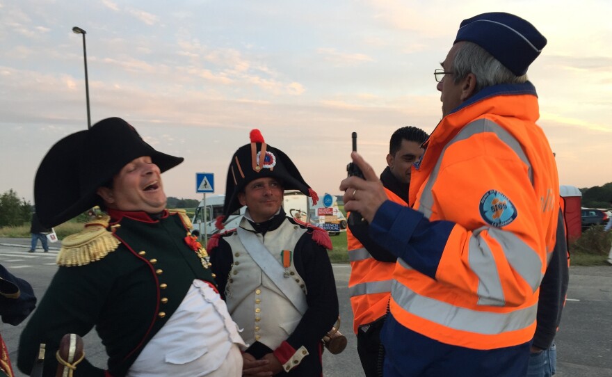 Napoleon, played by Paris lawyer Frank Samson, shares a moment with a Belgian traffic cop during Waterloo reenactment festivities.