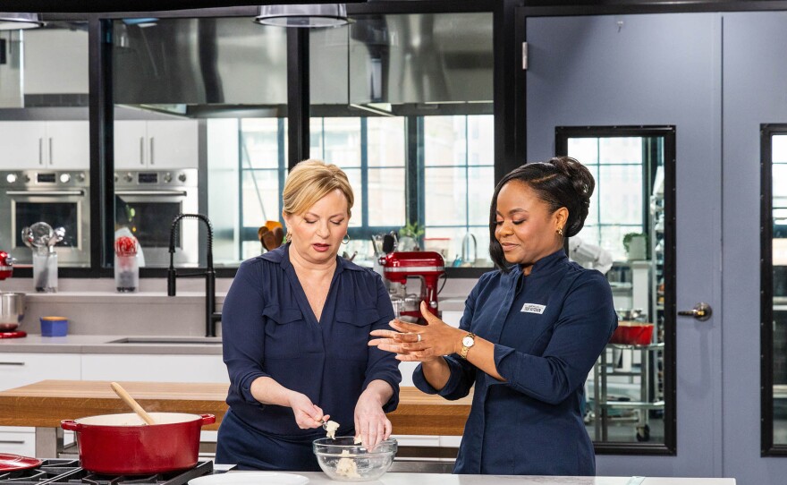 Test cook Antoinette Johnson (right) makes host Bridget Lancaster Jamaican Stew Peas with Spinners.