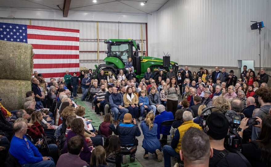 Republican presidential candidate Nikki Haley talks with voters in Waukee, Iowa on Dec. 10.