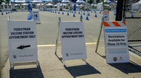 Signs directing pedestrians at the Petco Park vaccination super station in downtown San Diego, Feb. 22, 2021.