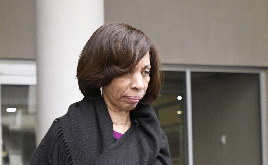 Former Baltimore mayor Catherine Pugh (right) leaves federal court in Baltimore on Thursday after pleading guilty to charges stemming from a fraudulent children's book sales to enrich herself and help her political career.