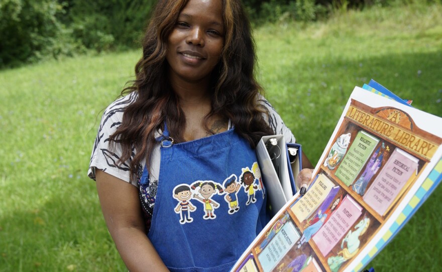 Lauretta Pugh holds posters she found at the Swap.