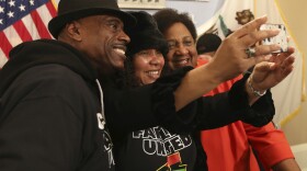 Assemblywoman Shirley Weber, D-San Diego, right, poses for a selfie with Cephus, left, and Beatrice Johnson, center, the aunt and uncle of Oscar Grant who was killed by BART police in 2009 after Weber announced her proposed bill that would allow police to use deadly force only when there is no reasonable alternative, Wednesday, Feb. 6, 2019. 