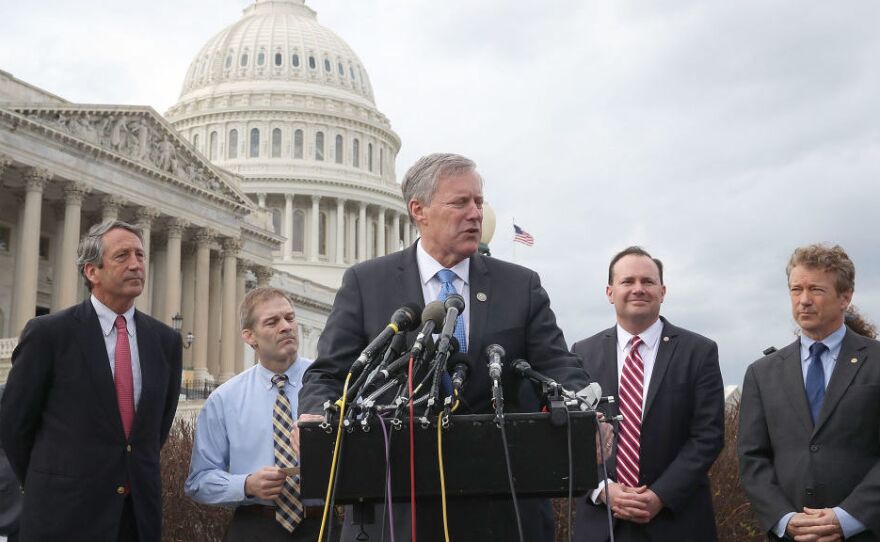 Rep. Mark Meadows, R-N.C., chairman of the Freedom Caucus, speaks out against the GOP leadership's plan to repeal and replace the Affordable Care Act on Tuesday, flanked by fellow Republicans Rep. Mark Sanford of South Carolina, Rep. Jim Jordan of Ohio, Sen. Mike Lee of Utah and Sen. Rand Paul of Kentucky.