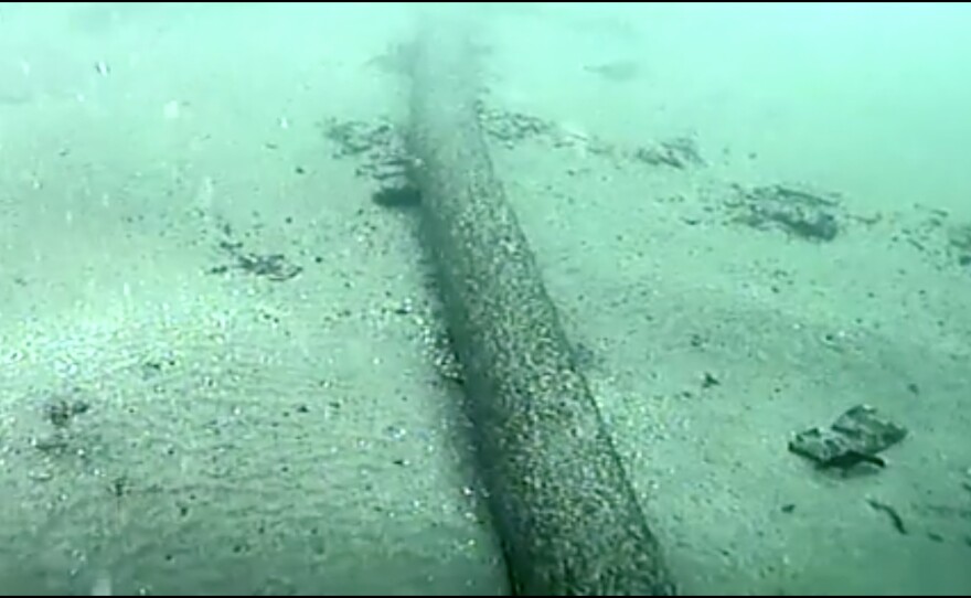 This still image from video taken Monday, Oct. 4, 2021, and provided by the U.S. Coast Guard shows an underwater pipeline that spilled tens of thousands of gallons of oil off the coast of Orange County, Calif. Video of the ruptured pipeline shows a thin crack along the top of the pipe that could indicate a slow leak that initially was difficult to detect, experts said.