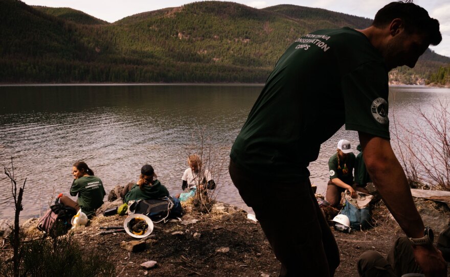 The Montana Conservation Corps crew breaks for lunch while spending the day working on trails near Tally Lake.