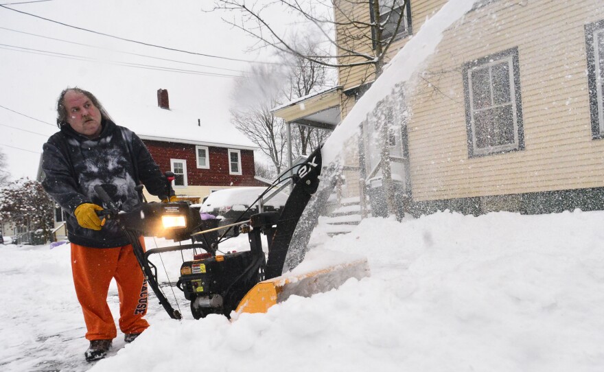 Harry Ruester, of Brattleboro, Vt., uses a snowblower while removing snow from his driveway during a snowstorm on Monday, Jan. 17, 2022.