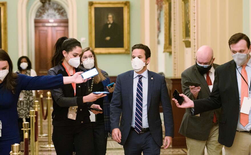 Democratic US Senator Brian Schatz speaks to reporters in the US Capitol in Washington, DC on February 13, 2021. Schatz is part of a group of lawmakers looking into the use of compassionate release waivers in federal plea deals.