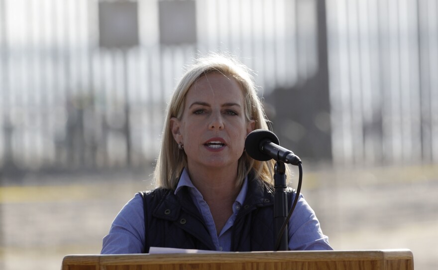 Secretary of Homeland Security Kirstjen Nielsen speaks in front of the border wall separating Tijuana, Mexico, and San Diego.