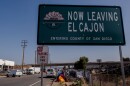 The sign marking the border between El Cajon and unincorporated San Diego County along SR67 is where a homeless encampment has sprung up, April 29, 2022.