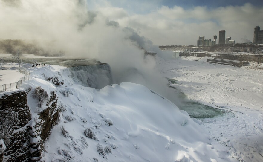 Tourists visit the frozen Niagara Falls on Thursday in Ontario, Canada. Niagara Falls has frozen over due to temperatures which dropped to 16F on Wednesday.