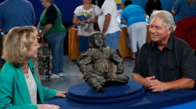 At ANTIQUES ROADSHOW in Tulsa, Oklahoma, appraiser Dessa Goddard admires this circa 1600 Ming Dynasty cast bronze guardian figure. Goddard assigns a value between $70,000-$100,000 to this Chinese figure.