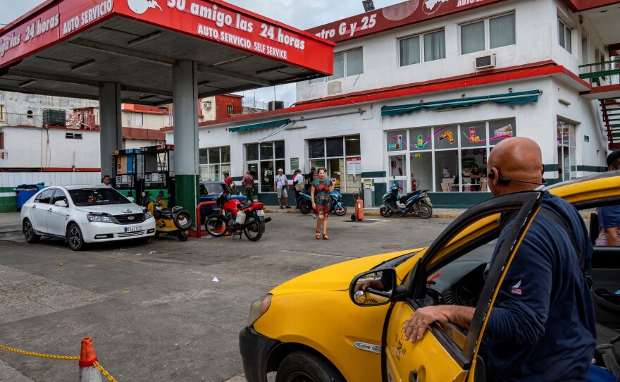 Drivers and motorcyclists line up to fill their tanks at a gas station in Havana, on Jan. 9, a day after the Cuban government announced a 500% hike in fuel prices.