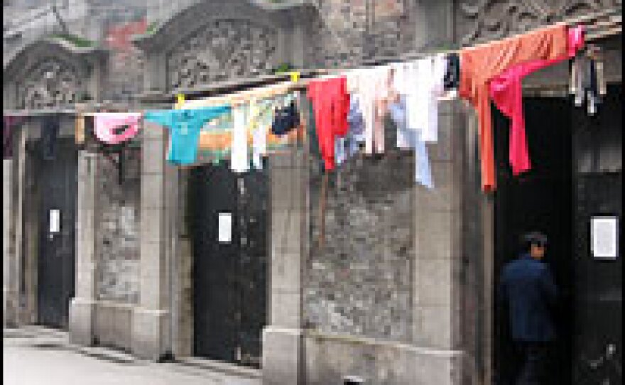The lanehouses of Dazhongli are a type found primarily in Shanghai. They combine decorative European touches, such as the carved stone doorways outside, with a Chinese room-layout inside.