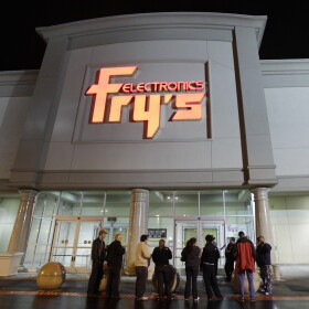 In this Oct. 21, 2009 file photo, a small crowd begins to gather outside a Fry's Electronics store in Renton, Wash.