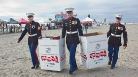 Camp Pendleton Marines collect gifts at the beach