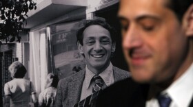 Stuart Milk, the nephew of the late gay activist Harvey Milk, sits next to a photograph of his uncle after a press conference announcing legislation to create a Harvey Milk Day in California March 3, 2009 in San Francisco, California.