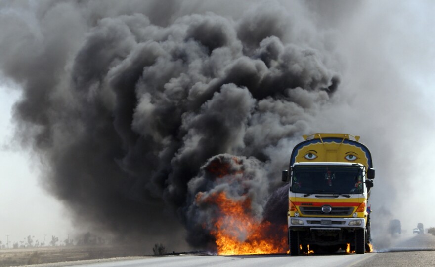 For the first seven years of the war in Afghanistan, almost all U.S. and NATO supplies were trucked overland to Afghanistan through parts of Pakistan effectively controlled by the Taliban. Here, smoke and flame rise from a burning NATO supplies oil tanker after armed militants torched the tankers  in Mithri, Pakistan, in February.