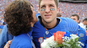 University of Florida quarterback Tim Tebow embraces his mother, Pam, during a November 2009 pre-game ceremony before an NCAA college football game against Florida State. The two are set to appear in a controversial anti-abortion ad that will air during the Super Bowl.