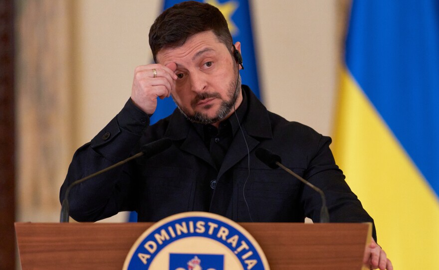 Ukrainian President Volodymyr Zelenskyy gestures during a joint news conference with Romanian President Nicusor Dan at the Cotroceni Presidential Palace in Bucharest, Romania, Thursday, March 12, 2026.