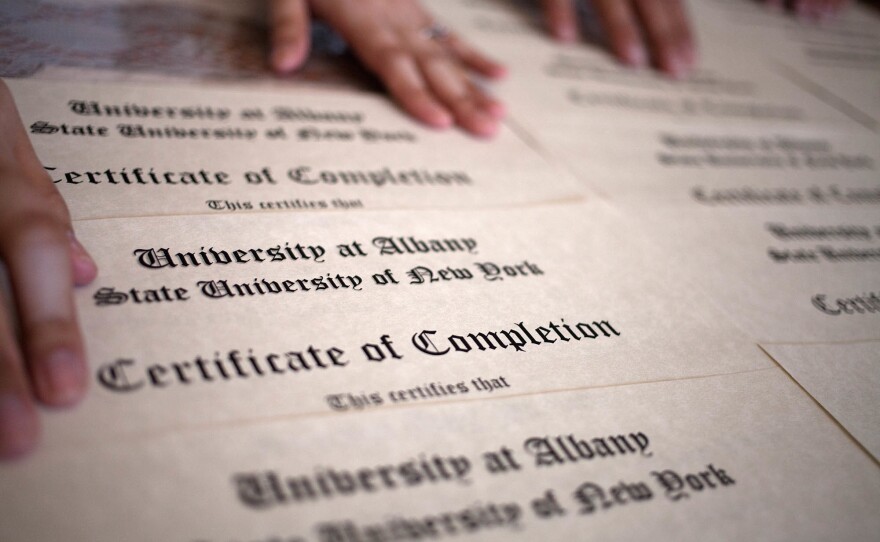 Students who graduate from the English language program are shown their certificates via Skype.