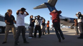 Undocumented Guatemalan immigrants are searched before boarding a deportation flight to Guatemala City, Guatemala at Phoenix-Mesa Gateway Airport on June 24, 2011 in Mesa, Arizona. 