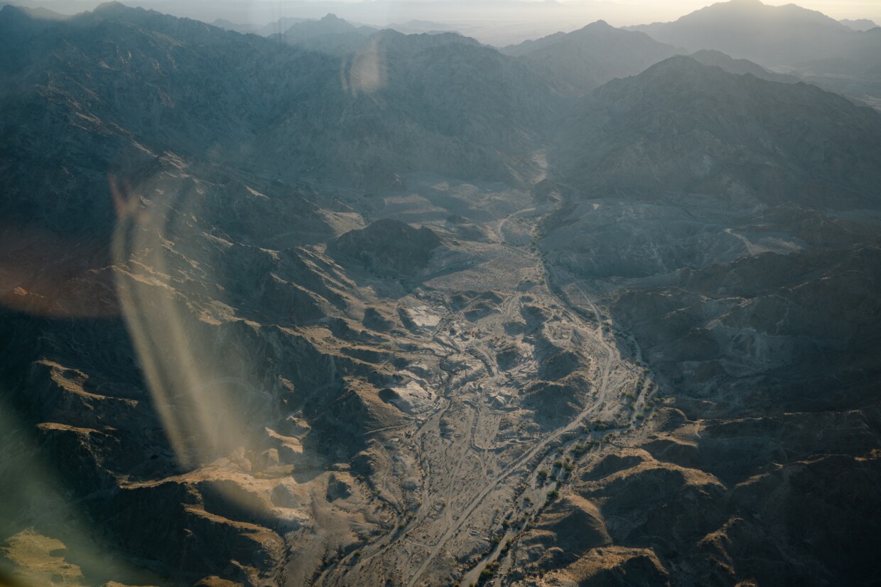 Morning light illuminates the scars of the old American Girl gold mine on the land of the proposed Kw'tsán National Monument during a flyover hosted by the Fort Yuma Quechan Tribe and Ecoflight, a conservation organization, on Oct. 16, 2024. The proposal would grant new federal protections to 390,000 acres of the Quechan Tribe's sacred homelands along the California-Arizona border.