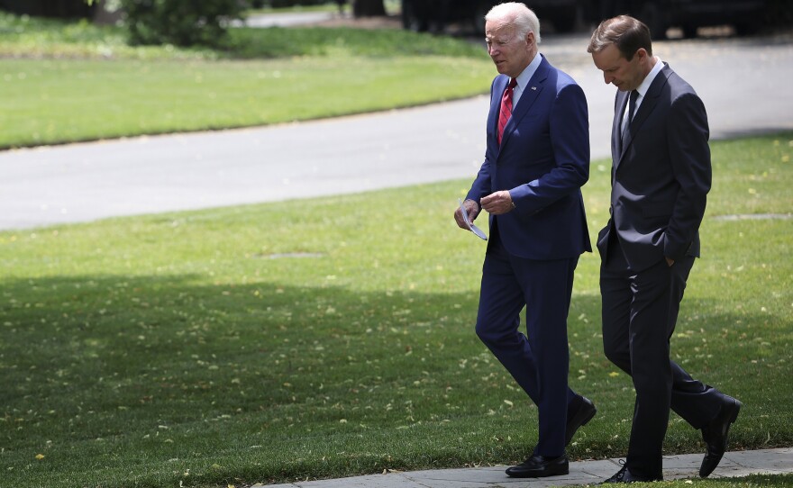 U.S. President Joe Biden, left, talks with Sen. Chris Murphy, D-Conn., outside the Oval Office of the White House on Tuesday as the two discuss ongoing negotiations in the Senate around gun law legislation.