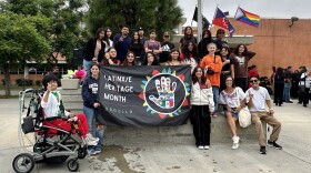 Students display a duplicate of the new district Latinx flag now flying over the Brucker Administration building, San Diego, Calif., on September 15, 2023. 