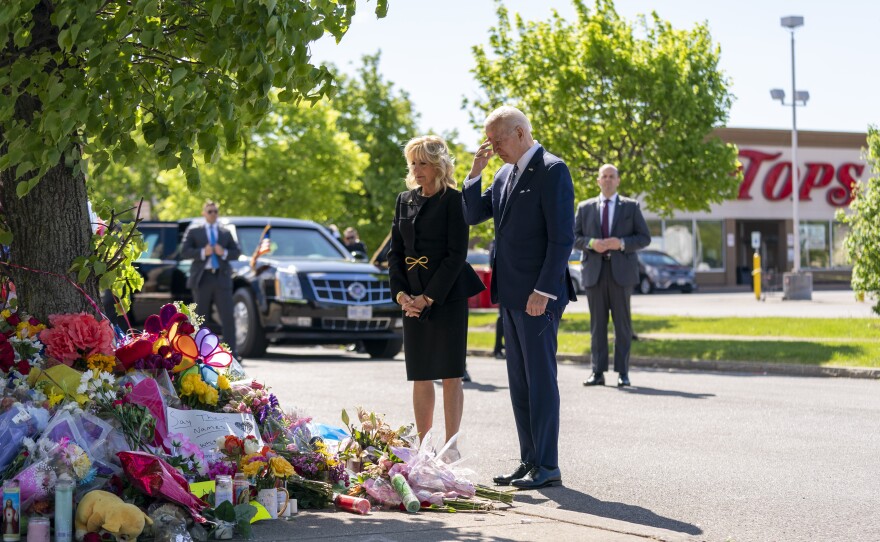 President Joe Biden and first lady Jill Biden visit the scene of a shooting at a supermarket to pay respects and speak to families of the victims of Saturday's shooting in Buffalo, N.Y., Tuesday, May 17, 2022.