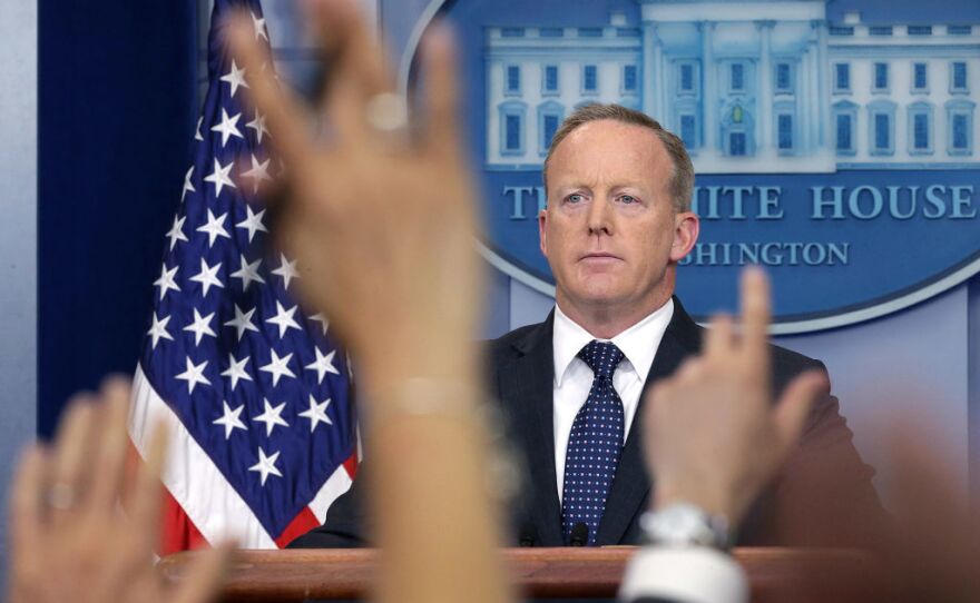 White House press secretary Sean Spicer briefs the media in June. He announced Friday that he was stepping down from his job in the Trump administration and would continue his service through August.