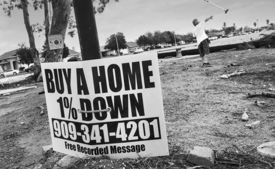 A sign lashed to street post across from Dream Street beckons would-be homebuyers with a seemingly irresistible offer.