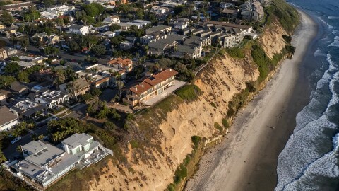 An aerial view of houses along a coastal bluff at Boneyard Beach in Encinitas on Sept. 3, 2024.