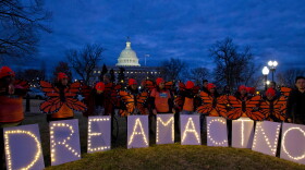 FILE - In this Jan. 21, 2018, file photo, demonstrators rally in support of Deferred Action for Childhood Arrivals (DACA) outside the Capitol Washington. 