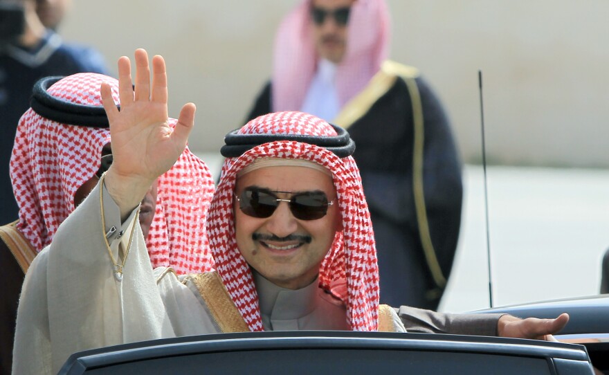 Saudi Prince Alwaleed bin Talal waves during an official visit to the West Bank city of Ramallah in 2014. The Saudi billionaire was detained last month in Riyadh and has not been seen since.