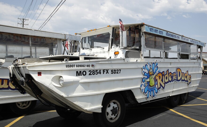 A duck boat sits idle in the parking lot of Ride the Ducks, an amphibious tour operator in Branson, Mo., in a photograph from July 2018.