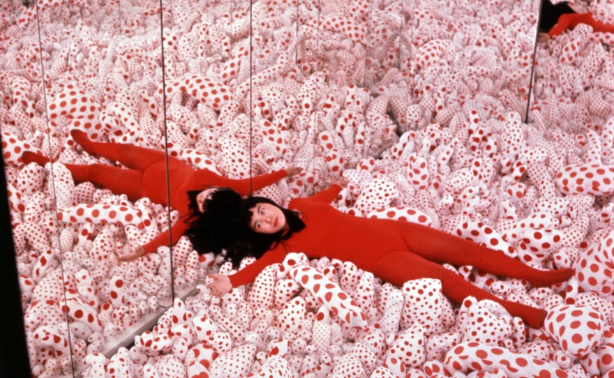 Yayoi Kusama in her <em>Phalli's Field</em> infinity room in 1965. Art dealer Richard Castellane says Kusama "shocked the living daylights out of people" with her art.