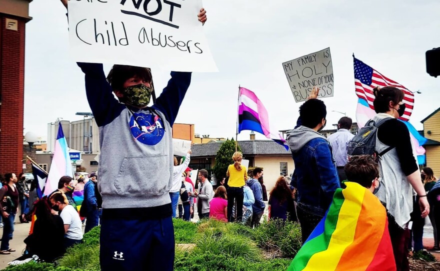 Eighth-grader Grayson Briggle protests for his rights as a transgender person in Texas.